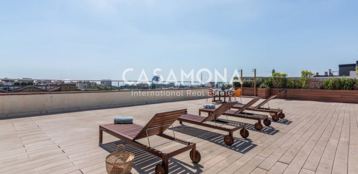 Moderno apartamento de 1 dormitorio con balcones y terraza en un edificio renovado